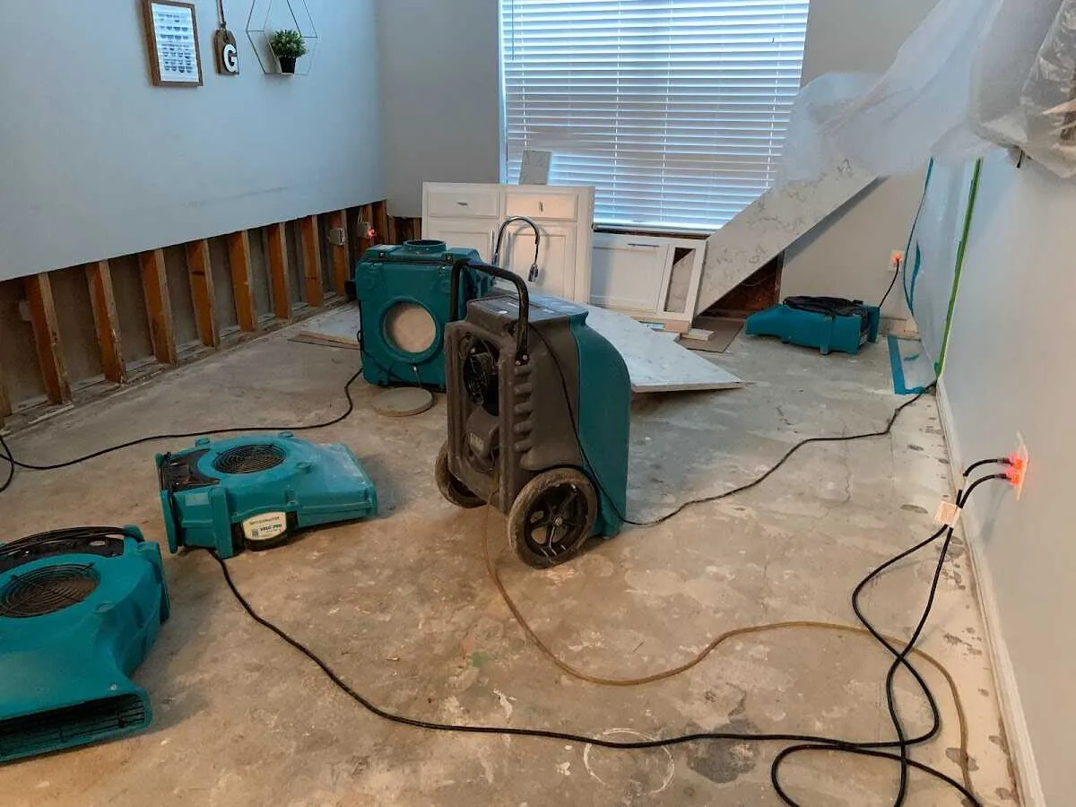 Dehumidifier in flood-cut room for Water Damage Restoration in Greenwich